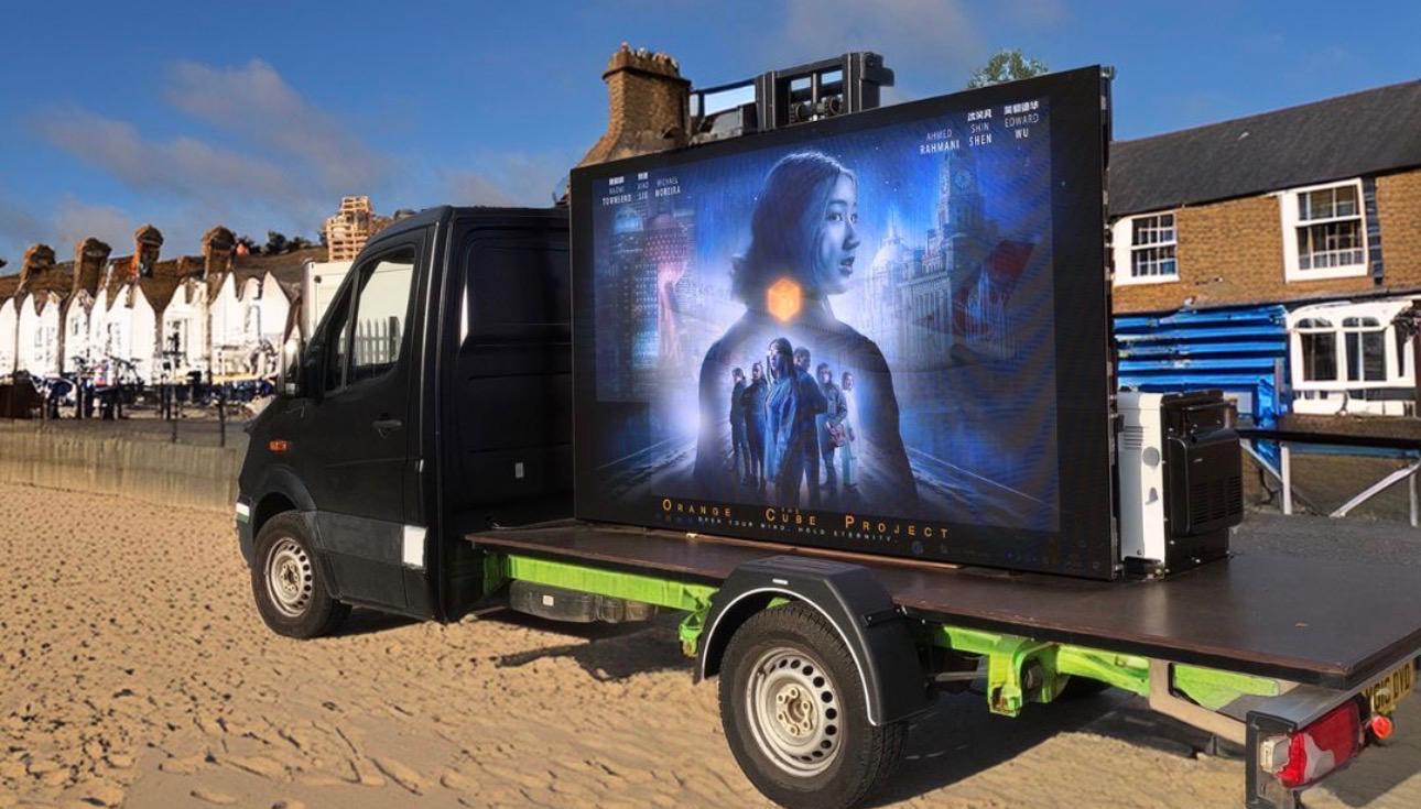 The MCR Screen Hire LED van parked with its full-colour screen lit up